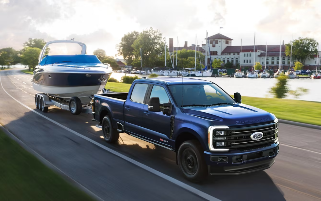 Blue 2026 Ford F-350 towing a boat