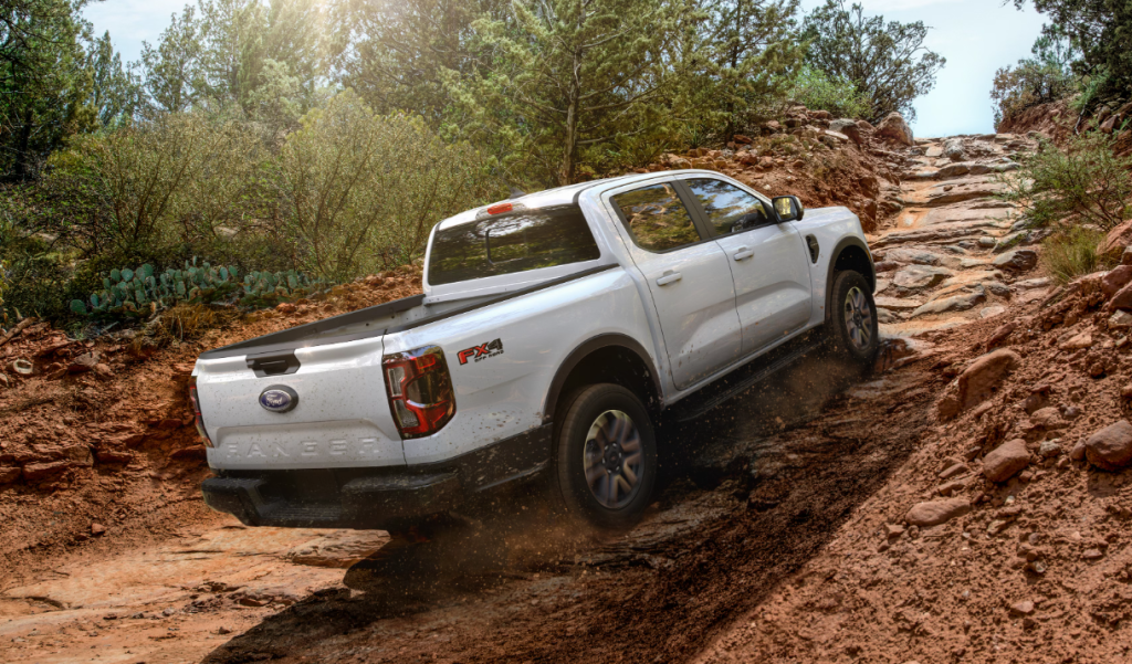 White 2025 Ford Ranger® being driven up a steep rocky trail