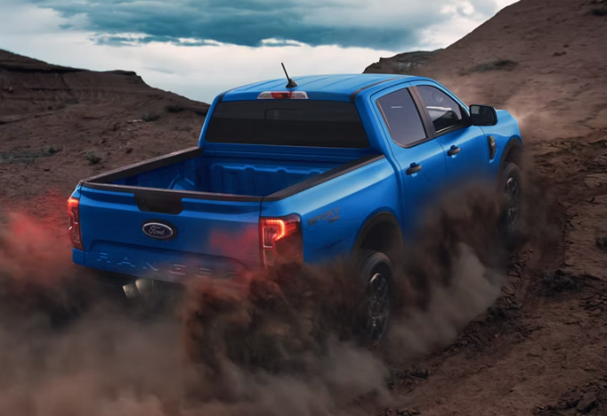 Blue 2026 Ford Ranger driving off-road