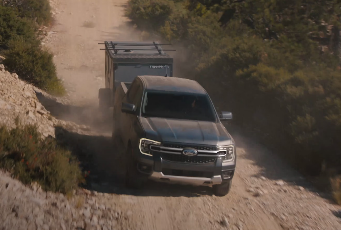 Gray 2026 Ford Ranger towing a trailer off-road